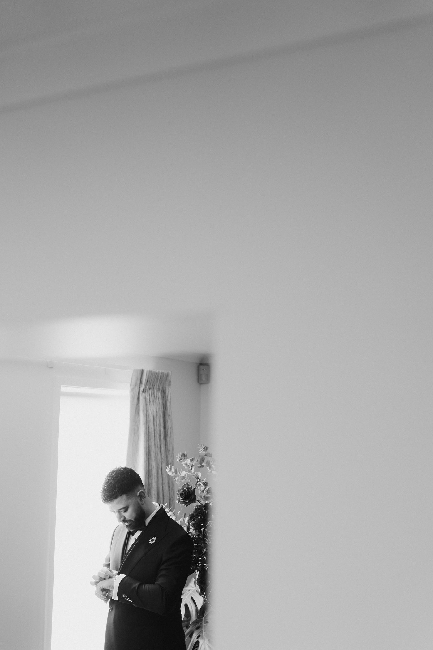 Groom in suit black and white portrait before the ceremony