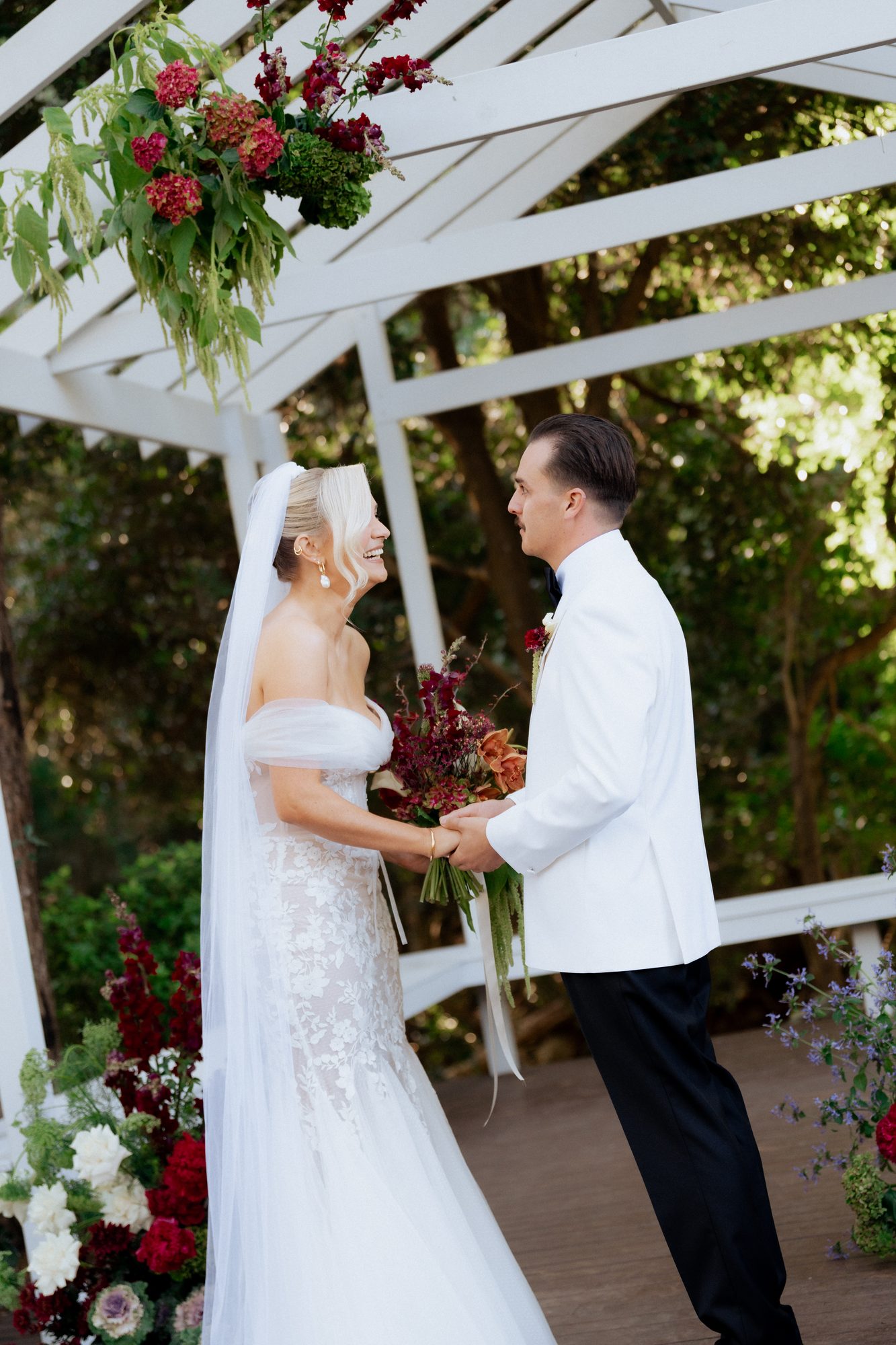 Elena laughing during wedding ceremony vows — The Lodge Jemberoo