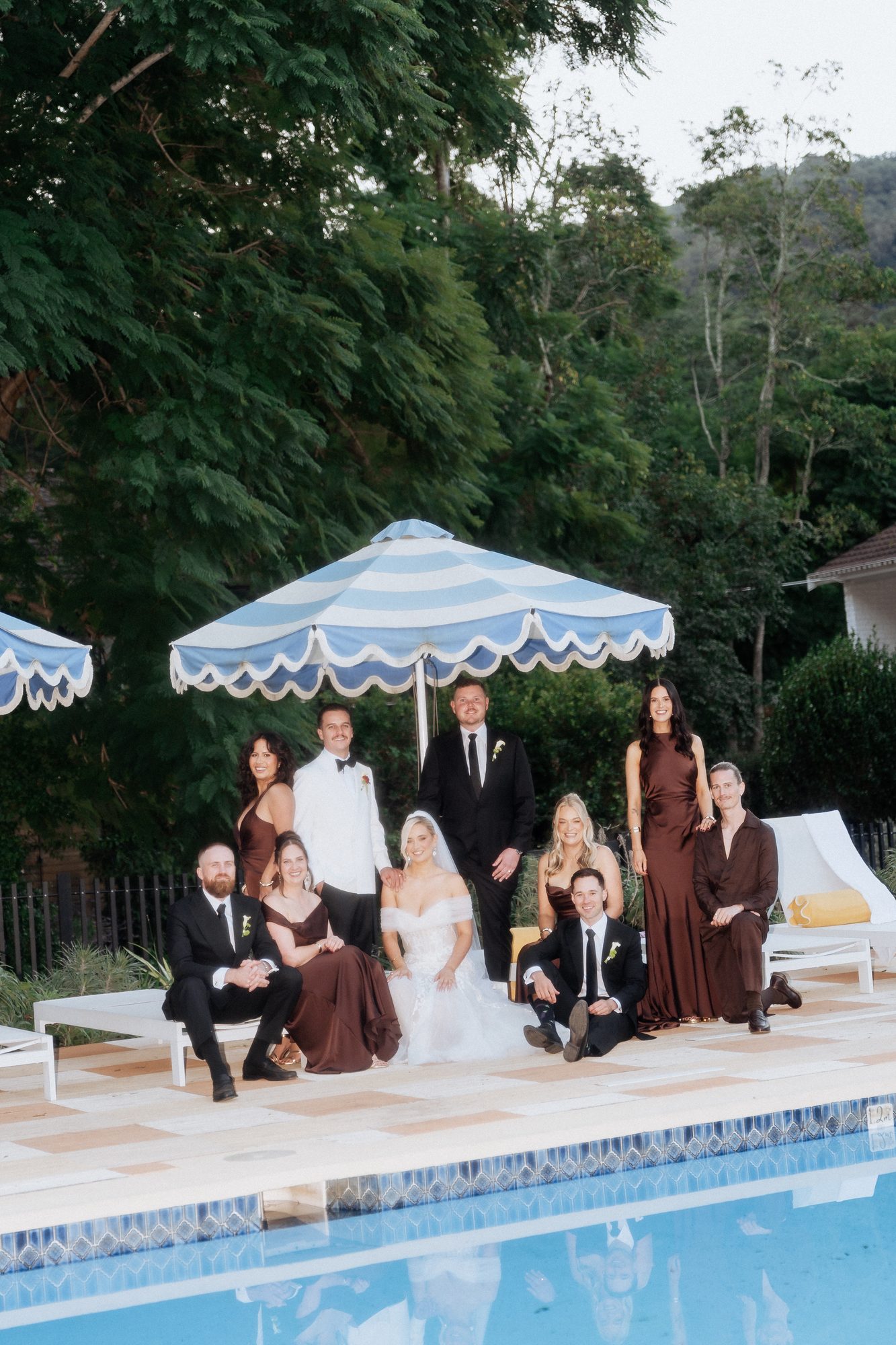 Bridal party portraits by the pool at The Lodge Jemberoo — Coco Celebrations wedding photography